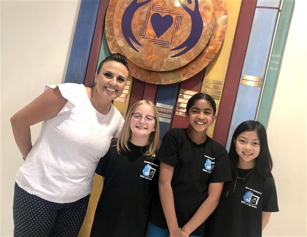 2021-2022 Battle of the Book semi-finalists are pictured here with Mrs. Estevez. Ellie, Eva, and Amelia were know as the Bookworm Trio!